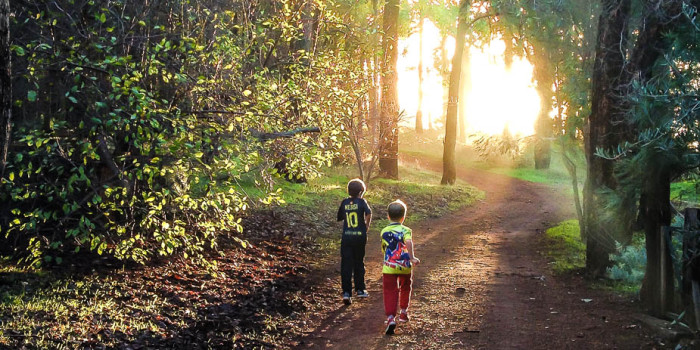 2 young buys playing on one of our walking tracks